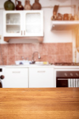Obraz na płótnie Canvas Blurred kitchen interior with desk space