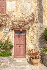 Fototapeta na wymiar Old wooden brown door in Rethymnon. Greece.