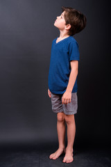 Full body shot of young handsome boy thinking and looking up © Ranta Images