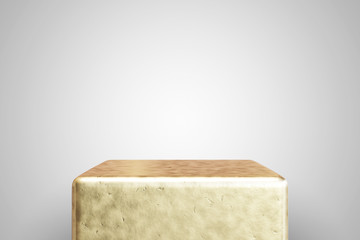 Empty gold podium on white background. Best for product presentation. 3d rendered cube pedestal.