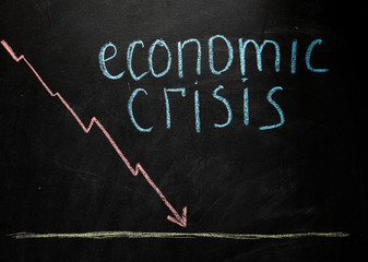 corona crash hand-drawn graph on chalkboard showing stock market collapse or financial economy...