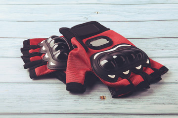 Motorcycle gloves isolated on wooden table
