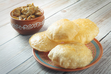 South Indian traditional food Poori or puri with country chicken curry