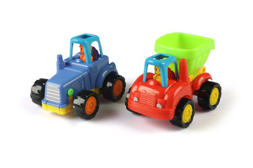 Plastic toy tractor isolated on white	