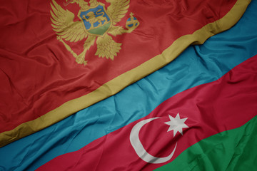 waving colorful flag of azerbaijan and national flag of montenegro.