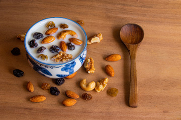 Cup with mix of dried fruits and yogurt