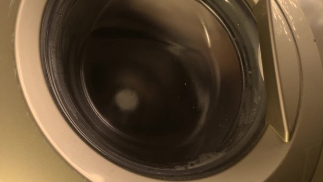 Washing machine with underwear inside as a background