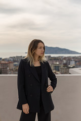 Fototapeta premium Self-confident business woman wearing elegant black suit