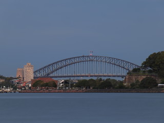 Fototapeta premium Drone Panoramic Aerial view of Sydney Harbour and the beautiful vibrant colours of the afternoon showing smooth harbour waters 