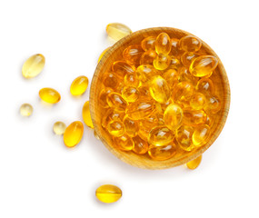 Bowl with fish oil capsules on white background