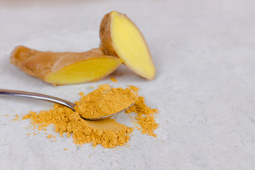 Ginger root and ginger powder top view.