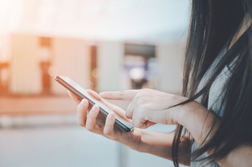 Close up image hand of woman using her mobile smartphone