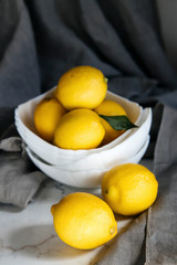 plate with fresh yellow lemons