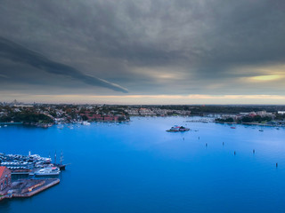 Drone Panoramic Aerial view of Sydney Harbour and the beautiful vibrant colours of the afternoon showing smooth harbour waters 