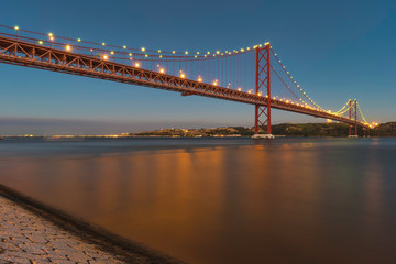 view of 25 de Abril Bridge in Lisbon, Portugal. Ponte 25 de abril. a suspension bridge connecting the city of Lisbon, capital of Portugal, to the municipality of Almada