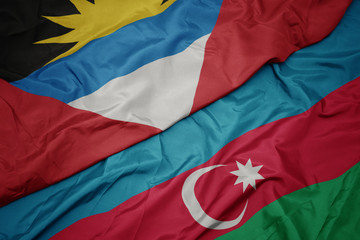 waving colorful flag of azerbaijan and national flag of antigua and barbuda.