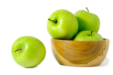 Group of green Apple granny smith above wooden bowl / basket isolated on white background
