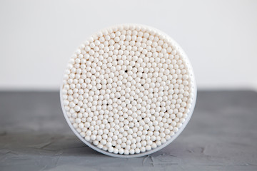 Bamboo cotton sticks for medicine, cosmetics, ear cleaning on a gray background