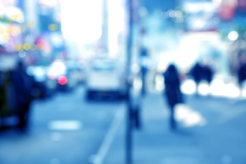 Blurry abstract background image of people walking on busy street