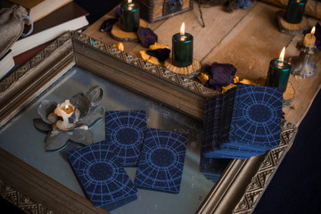 Tarot cards and esoteric concept. Magic rituals. Mystical table with details, 