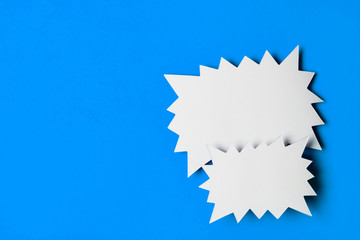 Blank promotional starburst sales banner on a bright blue background