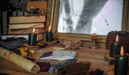 Tarot cards and esoteric concept. Magic rituals. Mystical table with details, 