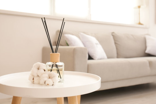 Reed diffuser on table in living room