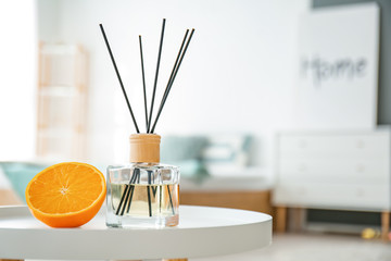 Reed diffuser on table in bedroom