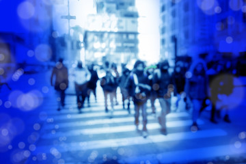 Blurry abstract background image of people walking on busy street
