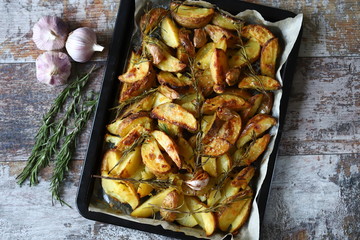 Baked Potato with Rosemary and Garlic. Cooking at home.