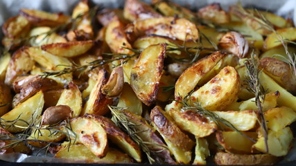Baked Potato with Rosemary and Garlic. Cooking at home.