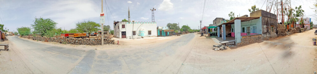 Fototapeta na wymiar A panoramic view of deserted streets at Roopnagar village during first day of curfew imposed in wake of the deadly novel coronavirus pandemic in Beawar, Rajasthan, India.
