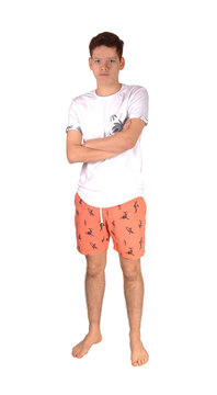 Young teen in his bading suit standing in the studio