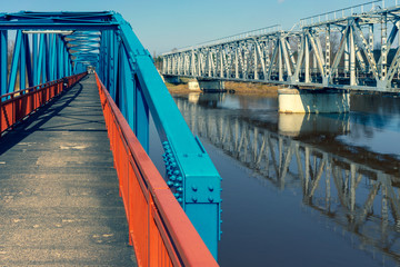 Pedestrian and railway bridges over the river