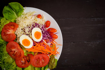 Vegetables Salad on black  wooden  background