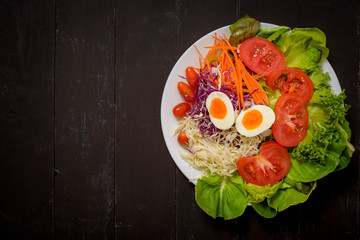 Vegetables Salad on black  wooden  background
