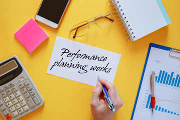 Workspace office desk - photo on top of workspace with blank note mockup on yellow background.