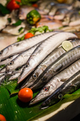 Fresh fish with price tag being sold on a stall at Thailand night market