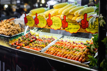 Skewers of grilled vegetables and meat in night market, thailand