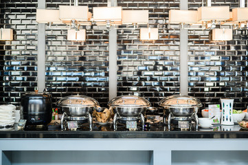Buffet Table with Row of Food Service Steam Pans