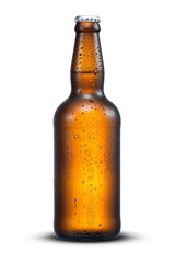 500ml brown beer beer bottle with drops isolated on a white background