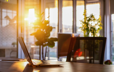 Notebook on desk in sunlight.