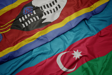 waving colorful flag of azerbaijan and national flag of swaziland.
