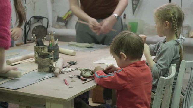 Children's master class in clay modeling. Ceramic workshop