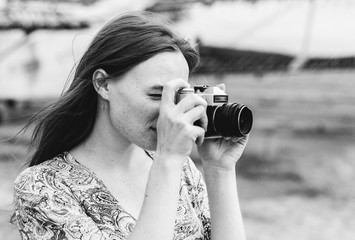 Beautiful woman natural face freckles casual female monochrome portrait lifestyle beauty girl with photo camera