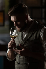 
Sommelier guy with a glass of white wine