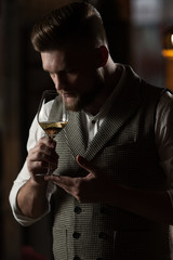Sommelier guy with a glass of white wine