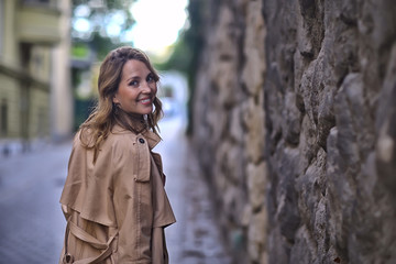 Fototapeta premium spring portrait of a girl with beautiful bokeh, happy beautiful woman on a walk