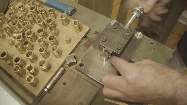 Goldsmith uses a Bending machine to create a gold ring 