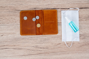 The purse has coin overlaid and masks placed on the office desk